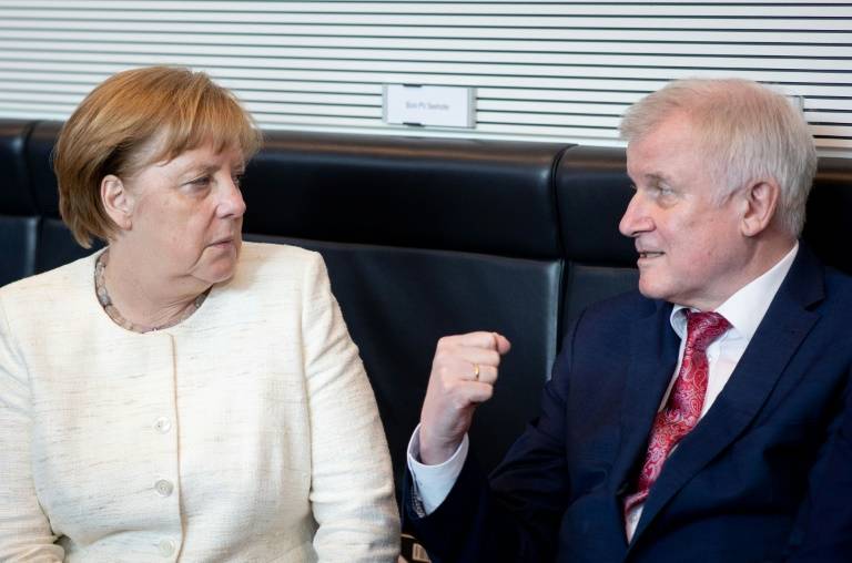 La chancelière allemande Angela Merkel avec le ministre de l