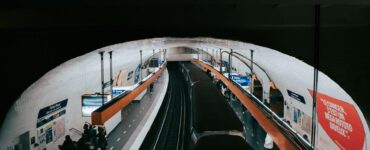 paris metro station with passengers and train