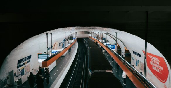 paris metro station with passengers and train